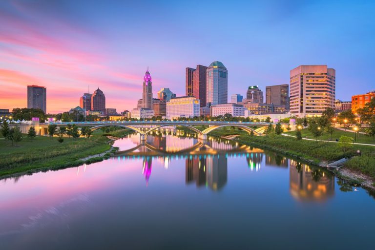 Columbus, Ohio, USA skyline on the river at dusk.