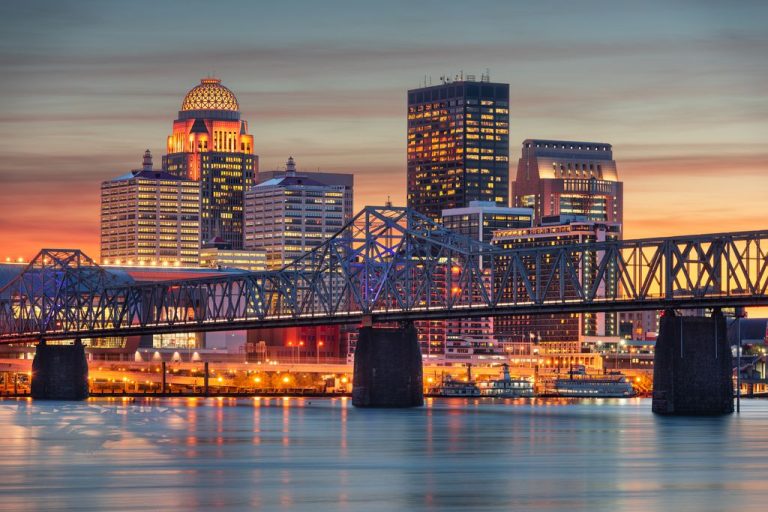 Louisville, Kentucky, USA skyline on the river at dusk.